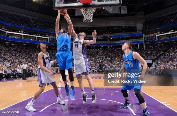 Hammons of the Dallas Mavericks rebounds against George Papagiannis of the Sacramento Kings on April 4, 2017 at Golden 1 Center in Sacramento,...