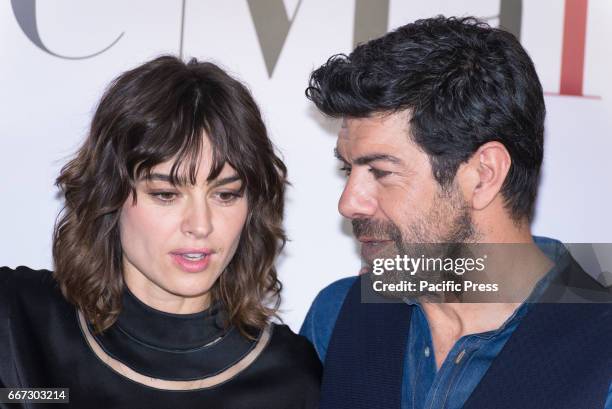 Kasia Smutniak and Pierfrancesco Favino attend a photocall for "Moglie E Marito".