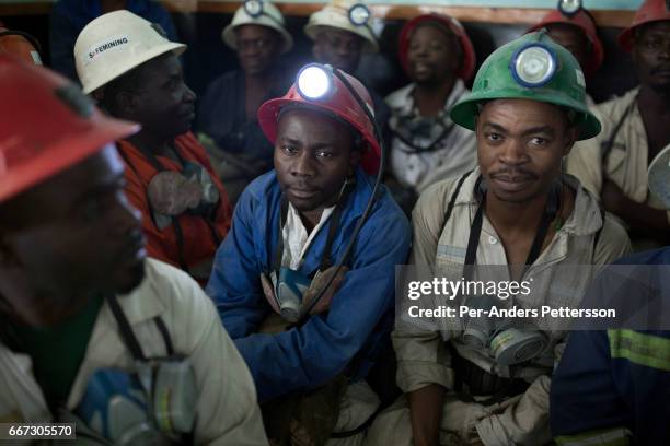 Mine workers wait to descend underground for an 8-hour shift mining copper in one of the shafts at Mopani on July 6, 2016. Glencore, an Anglo-Swiss...
