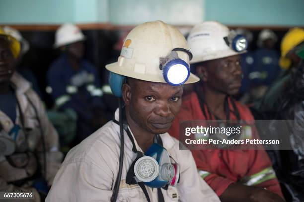 Mine workers wait to descend underground for an 8-hour shift mining copper in one of the shafts at Mopani on July 6, 2016. Glencore, an Anglo-Swiss...
