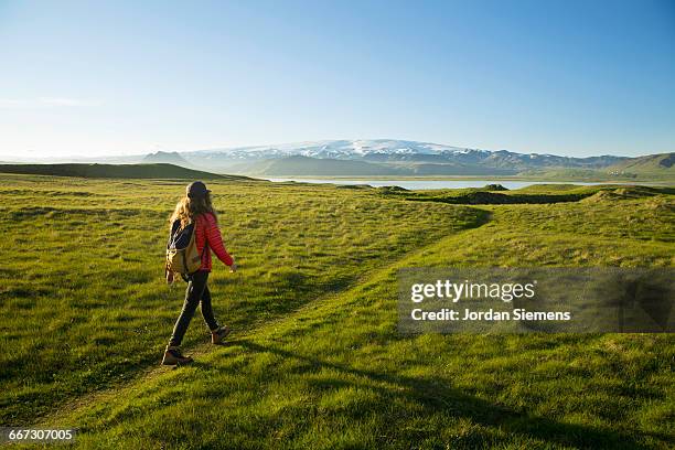 a woman hiking a beautiful trail. - dramatic landscape stock pictures, royalty-free photos & images