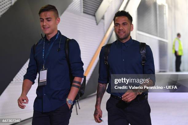 Daniel Alves and Paulo Dybala of Juventus arrive at his dressing room ahead of the the UEFA Champions League Quarter Final first leg match between...