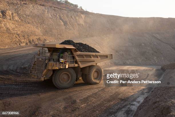 The sun sets on one of the open pit copper mines at Mutanda Mining Sarl on July 6, 2016 in Kolwezi, DRC. The mine is owned by Glencore, an...