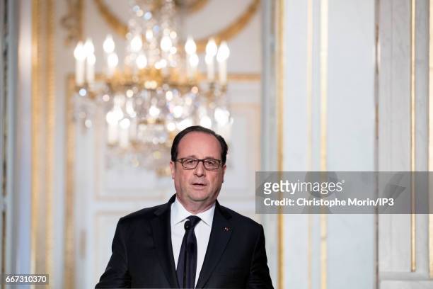 French President Francois Hollande holds a press conference with President of Guinea Alpha Conde after a meeting at the Elysee Palace on April 11,...