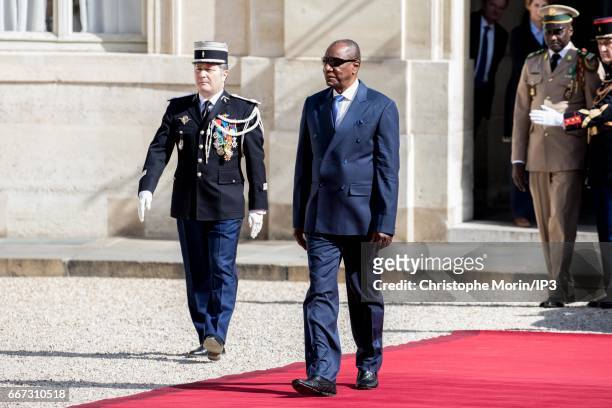 French President Francois Hollande welcomes President of Guinea Alpha Conde for a meeting at the Elysee Palace on April 11, 2017 in Paris, France....