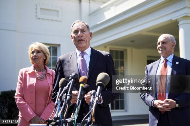 Toby Cosgrove, president and chief executive officer of Cleveland Clinic Foundation, center, speaks to members of the media while Betsy DeVos, U.S....