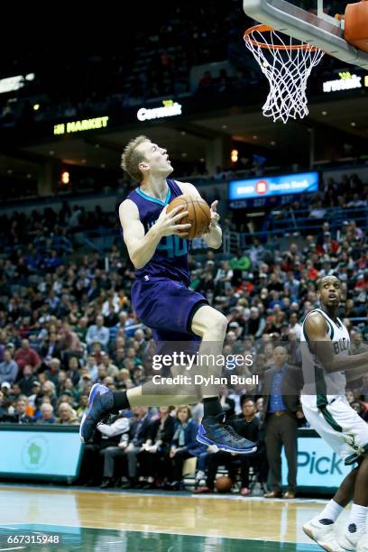 Cody Zeller of the Charlotte Hornets attempts a layup in the fourth quarter against the Milwaukee Bucks at BMO Harris Bradley Center on April 10,...