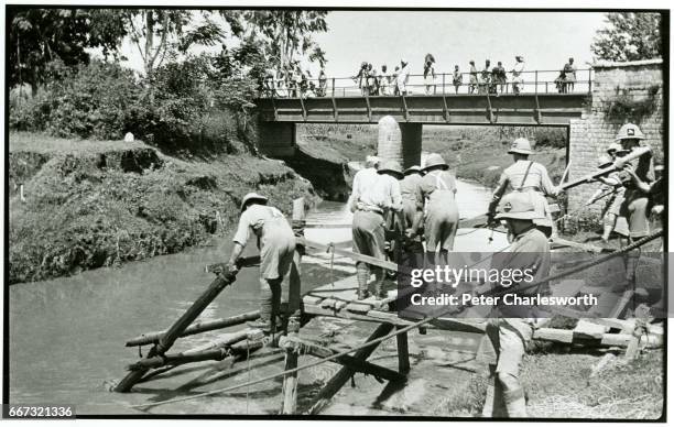 Trestle bridge, launching second trestle." Briitish soldiers practise their bridge-making skills. Background to this image: With the threat of War...