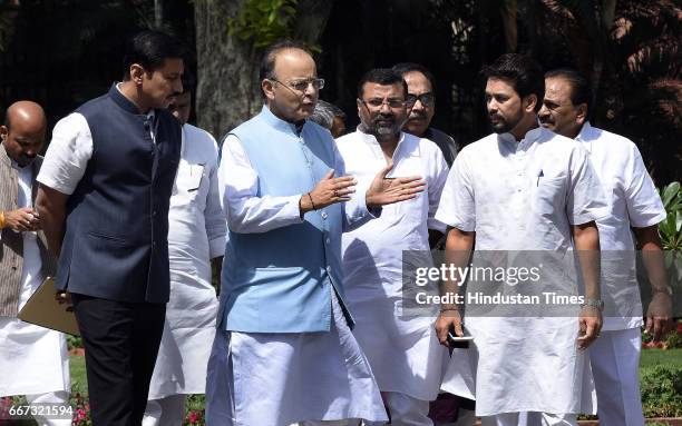 Finance Minister, Defence, Minister of Corporate Affairs Arun Jaitley, talking to Lok Sabha MP from Hamirpur in Himachal Pradesh Anurag Thakur and...