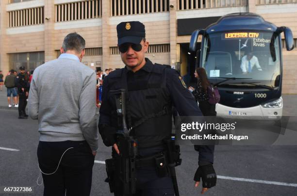 Security measures are seen alongside the Leicester City team coach during a Leicester City training session and press conference on the eve of their...