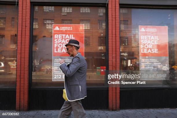 Long empty store front stands in a trendy West Village neighborhood on April 11, 2017 in New York City. Many residents and tourists alike are...