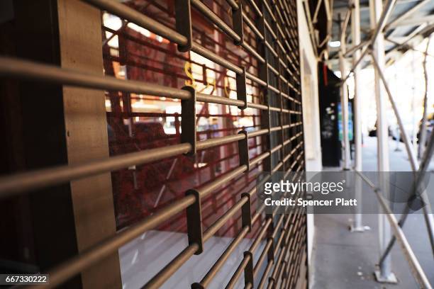 Empty store fronts stand in a trendy West Village neighborhood on April 11, 2017 in New York City. Many residents and tourists alike are noticing an...