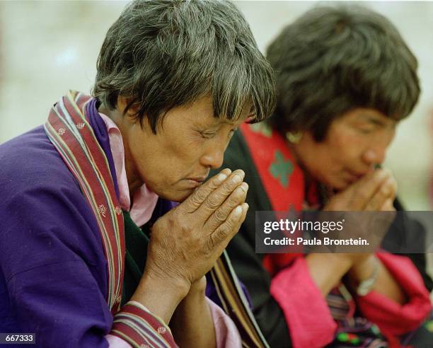 Bhutanese pray during the Supreme Prayer festival "Melam Chenpo", May 9, 2000 in Jakar, Bhutan. Bhutan remains the only independent Himalayan...