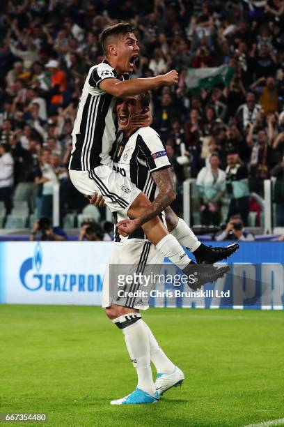 Paulo Dybala of Juventus celebrates scoring the second goal to make the score 2-0 with Mario Mandzukic during the UEFA Champions League Quarter Final...