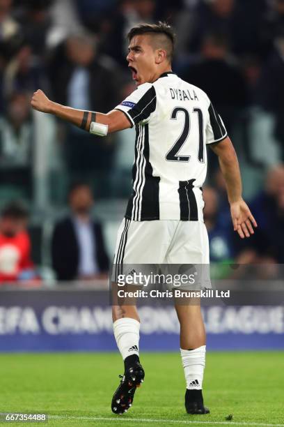 Paulo Dybala of Juventus celebrates scoring the second goal to make the score 2-0 during the UEFA Champions League Quarter Final first leg match...