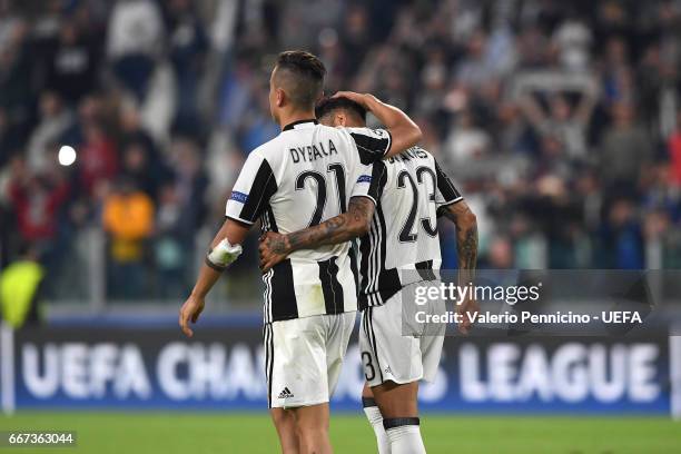 Paulo Dybala and Daniel Alves of Juventus celebrate victory at the end of the UEFA Champions League Quarter Final first leg match between Juventus...