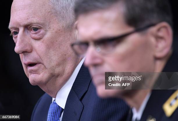Secretary of Defense James Mattis and US Central Command Commander Joseph Votel take part in a briefing at the Pentagon in Washington, DC on April...