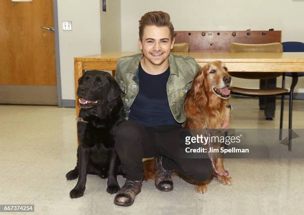 Singer/songwriter Hunter Hayes with two WCC service dogs attend the Heartgardians Campaign Launch at Manhattan VA Medical Center on April 11, 2017 in...