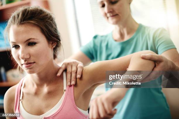 you'll be back in the game in no time - physiotherapy shoulder stock pictures, royalty-free photos & images