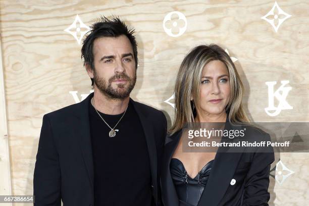 Actor Justin Theroux and Actress Jennifer Aniston attend the "LVxKOONS" exhibition at Musee du Louvre on April 11, 2017 in Paris, France.