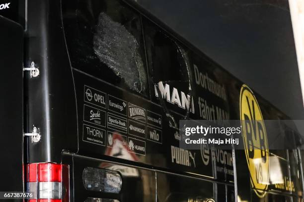 Team bus of the Borussia Dortmund football club damaged in an explosion is seen on April 12, 2017 in Dortmund, Germany. According to police an...