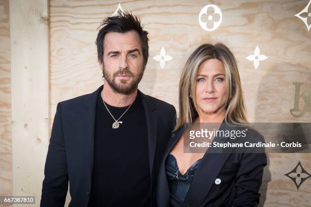 Justin Theroux and Jennifer Aniston attend the Louis Vuitton's Dinner for the Launch of Bags by Artist Jeff Koons at Musee du Louvre on April 11,...