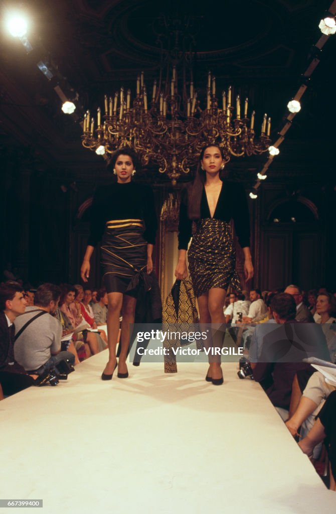 A model walks the runway at the Lecoanet Hemant Haute Couture... News ...