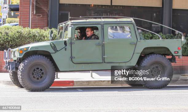 Arnold Schwarzenegger and his daughter Katherine are seen on April 11, 2017 in Los Angeles, California.