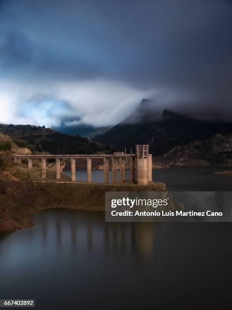 tower in reservoir lake, granada, spain - tiempo atmosférico stockfoto's en -beelden