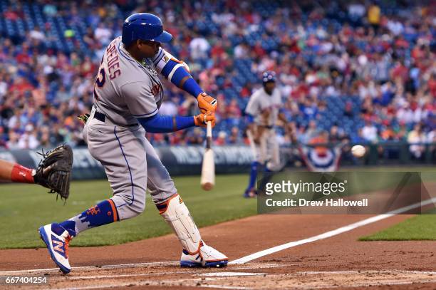 Yoenis Cespedes of the New York Mets hits a three run home run in the first inning against the Philadelphia Phillies at Citizens Bank Park on April...