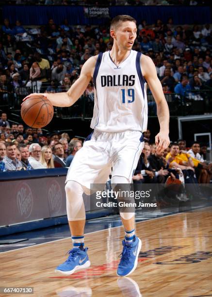 Jarrod Uthoff of the Dallas Mavericks handles the ball against the Denver Nuggets during the game on April 11, 2017 at the American Airlines Center...