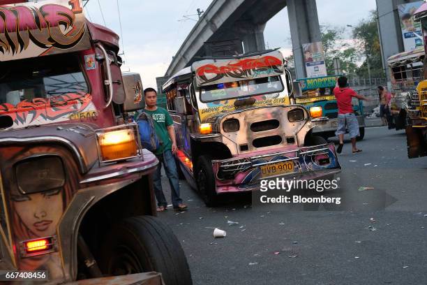 Jeepneys wait for commuters in Manila, the Philippines, on Sunday, April 9, 2017. Smoke-belching jeepneys are as iconic to Manila as the cable cars...