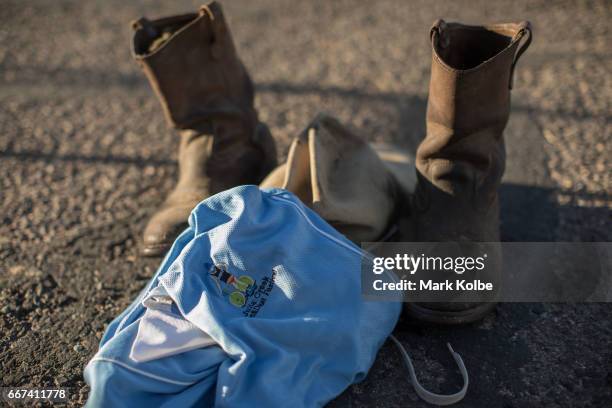 The hat, boots and shirt of Fred Schneider of Charters Towers are seen in preparation for racing during the Dirt 'n' Dust Triathlon, which is part of...