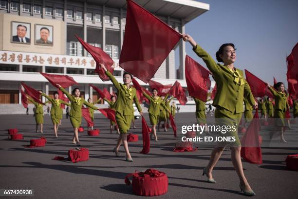 Members of a propaganda troupe perform in a public square in Pyongyang on April 12, 2017.