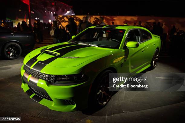 The Fiat Chrysler Automobiles NV Dodge Charger Hellcat stands on display during an event ahead of the 2017 New York International Auto Show in New...