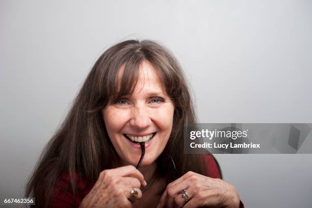 beautiful mature woman smiling - studiofoto stock pictures, royalty-free photos & images