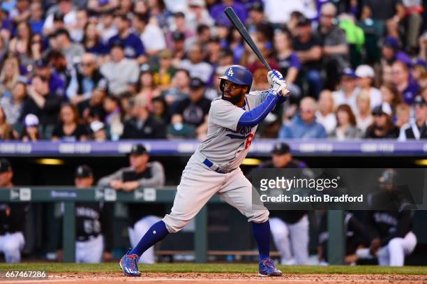 Andrew Toles of the Los Angeles Dodgers bats against the Colorado Rockies in the third inning of a game at Coors Field on April 8, 2017 in Denver,...