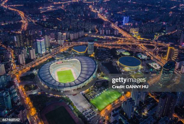 aerial view of shanghai stadium in xuhui district - soccer stadium - fotografias e filmes do acervo