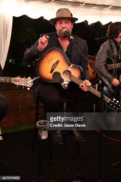 Recording Artist Lee Brice signs a guitar to be auctioned at the 2017 "Hope Song" Fundraiser at East Ivy Mansion on April 11, 2017 in Nashville,...
