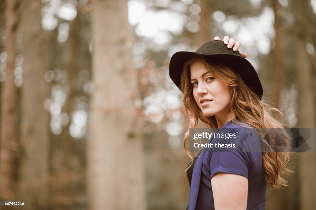 Beautiful young woman in the woods