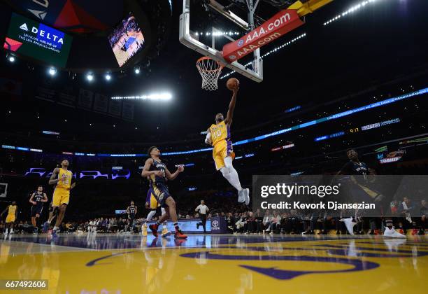 David Nwaba of the Los Angeles Lakers scores a basket against Jrue Holiday of the New Orleans Pelicans during the second half of the basketball game...