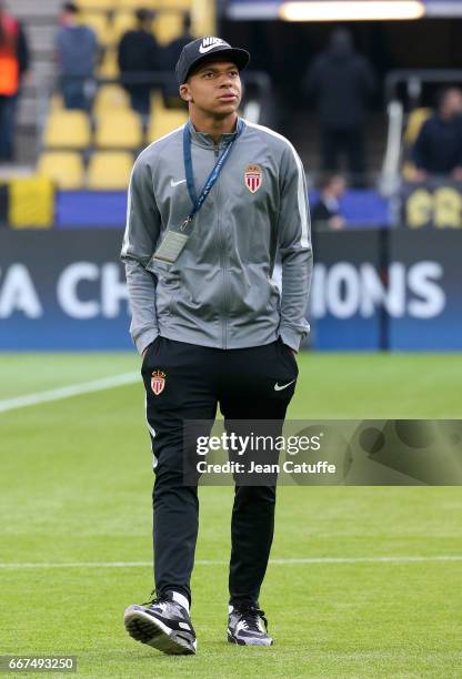 Kylian Mbappe of Monaco looks on while arriving at the stadium before the later postponed UEFA Champions League Quarter Final first leg match between...