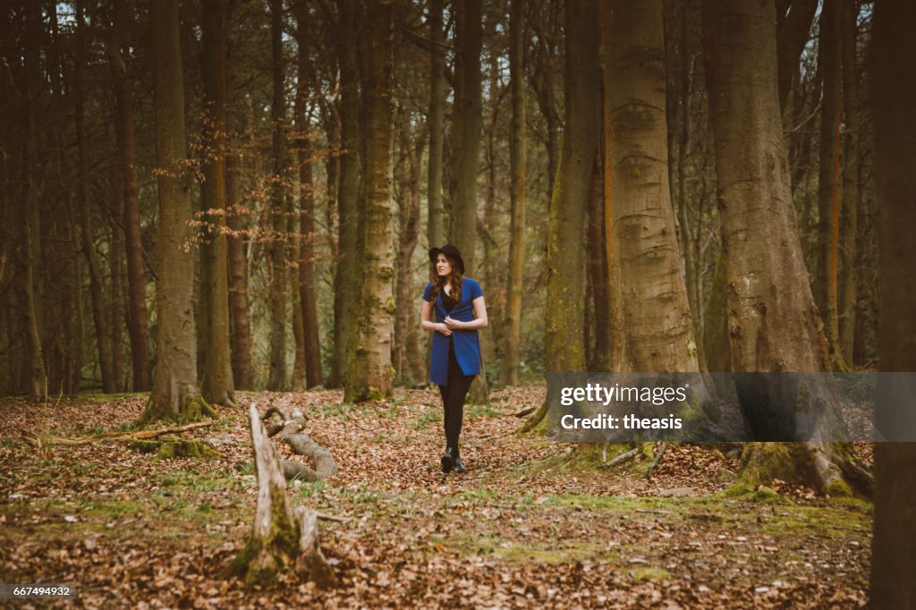 Beautiful young woman in the woods