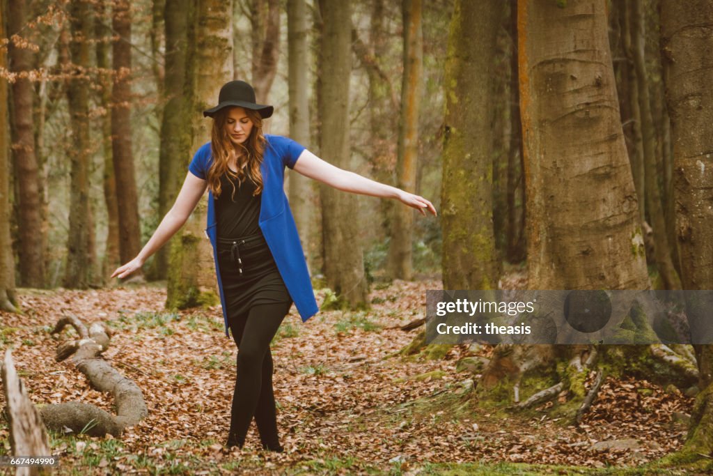 Beautiful young woman in the woods