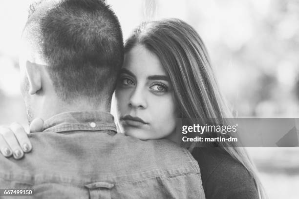 young woman comforting unhappy friend - i love you stock pictures, royalty-free photos & images