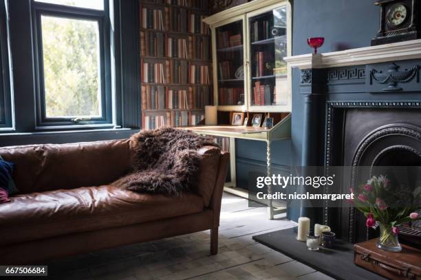 fashionable vintage styled living room - tidy bookshelf stock pictures, royalty-free photos & images