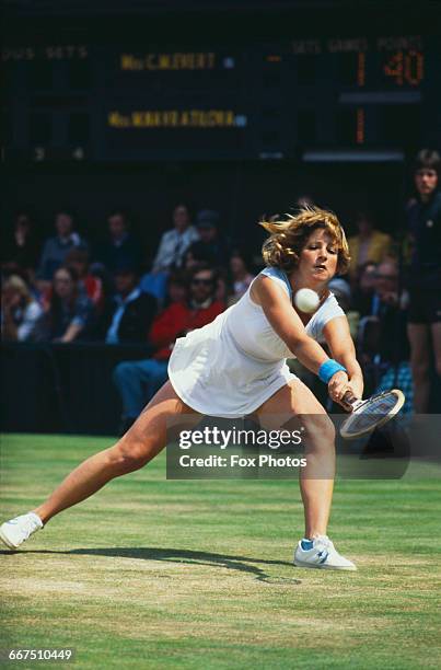 American tennis player Chris Evert competing against Martina Navratilova in the final of the Ladies' Singles tournament at The Championships,...