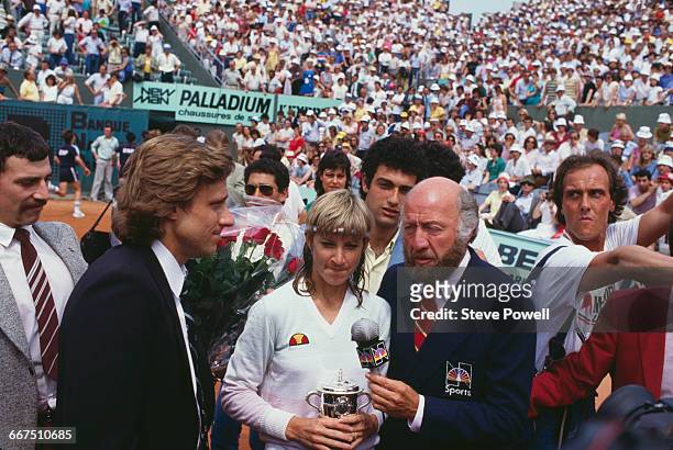 American tennis player Chris Evert-Lloyd is interviewed by NBC Sports commentator Bud Collins after she won the French Open at the Stade Roland...