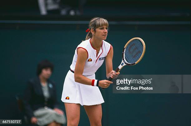 American tennis player Chris Evert-Lloyd competing against Pam Shriver in the semi-finals of the Women's Singles tournament at The Championships,...