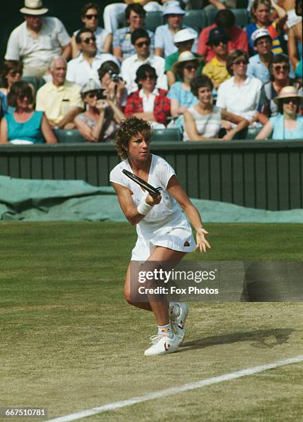 American tennis player Chris Evert-Lloyd competing against Kathy Rinaldi in the semi-finals of the Women's Singles tournament at The Championships,...